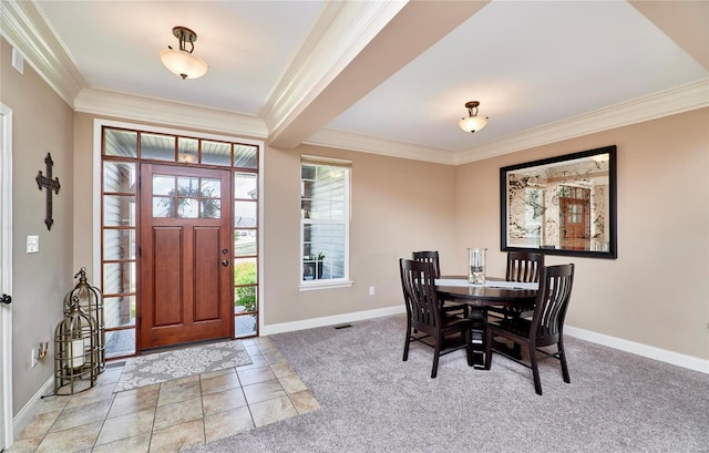 dining space with ornamental molding and light tile patterned flooring