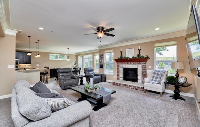 living room with ornamental molding, carpet flooring, and a wealth of natural light