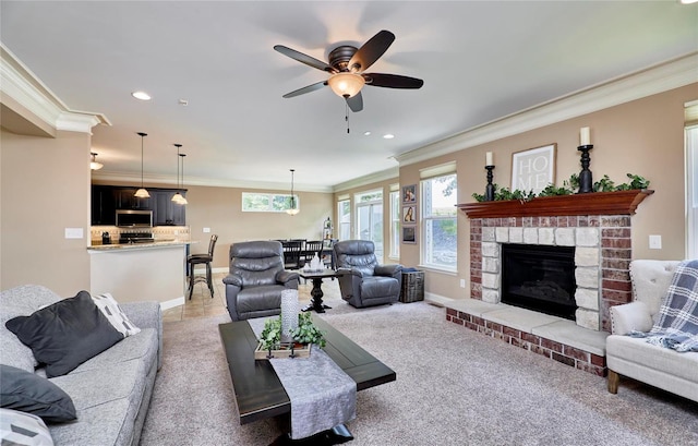 living room featuring ceiling fan, ornamental molding, and a brick fireplace