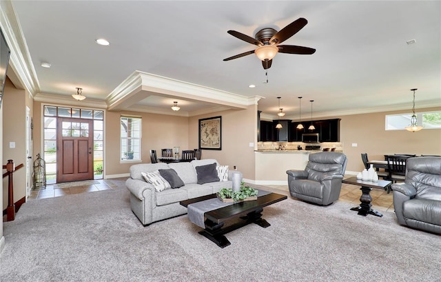 carpeted living room with crown molding