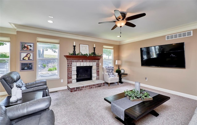 living room with crown molding, ceiling fan, and carpet floors