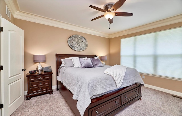 carpeted bedroom with crown molding and ceiling fan