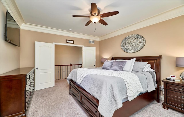 carpeted bedroom featuring crown molding and ceiling fan