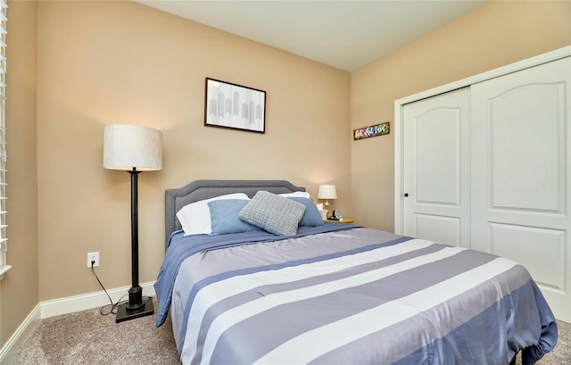 bedroom with light colored carpet and a closet