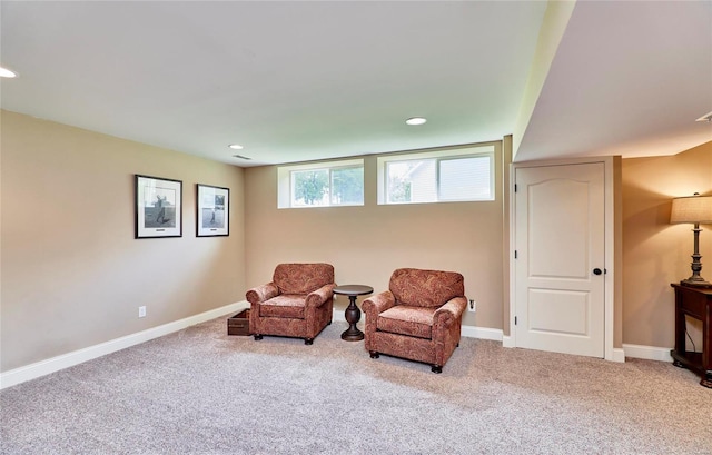 living area with light colored carpet