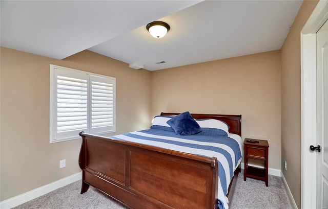 bedroom with light colored carpet