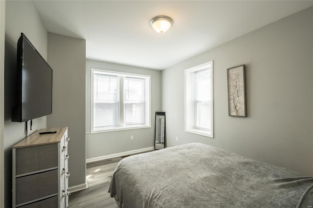 bedroom with light hardwood / wood-style flooring