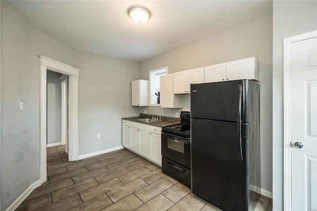 kitchen with white cabinetry, sink, and black appliances