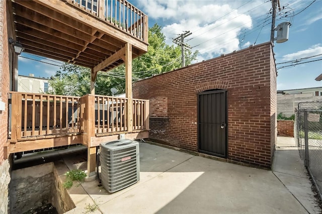 view of patio featuring a wooden deck and cooling unit