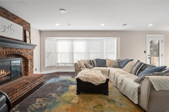 living room featuring dark hardwood / wood-style floors and a fireplace