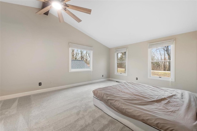 carpeted bedroom featuring vaulted ceiling and ceiling fan