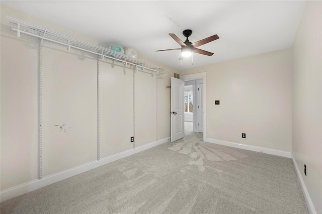 unfurnished bedroom with carpet floors and ceiling fan