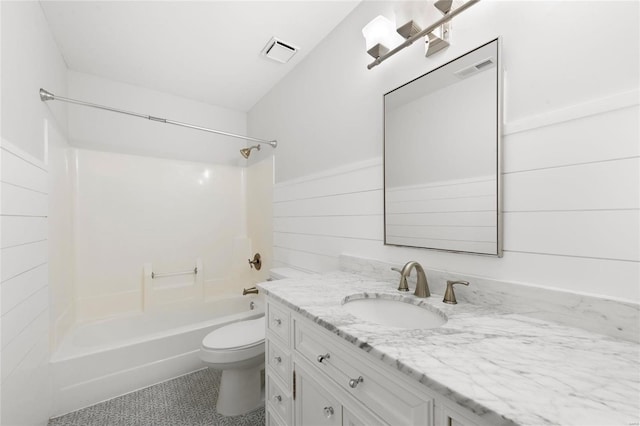 full bathroom featuring vanity, wooden walls, shower / washtub combination, and toilet