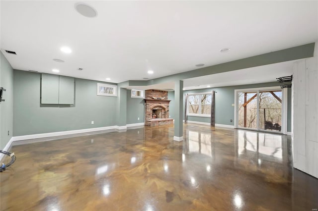 unfurnished living room with a brick fireplace