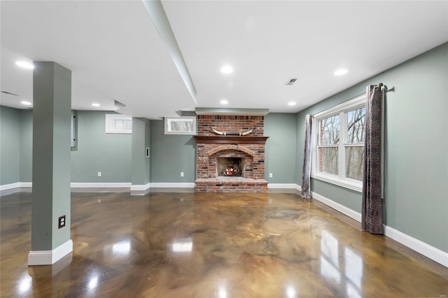 unfurnished living room featuring a brick fireplace