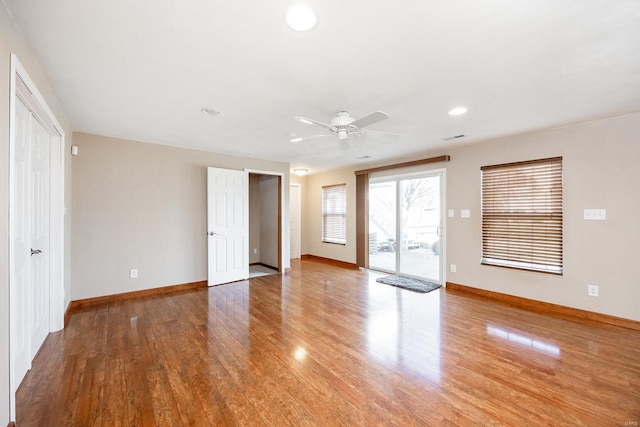 interior space featuring light wood finished floors, recessed lighting, a ceiling fan, and baseboards