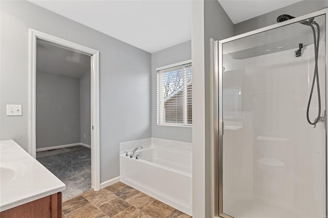 bathroom featuring vanity and plus walk in shower