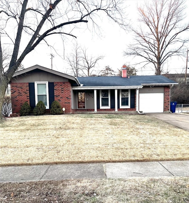 single story home with a garage and a front lawn