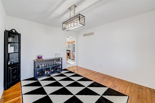 dining area with hardwood / wood-style flooring