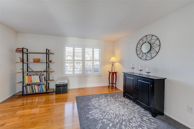 sitting room with light hardwood / wood-style floors