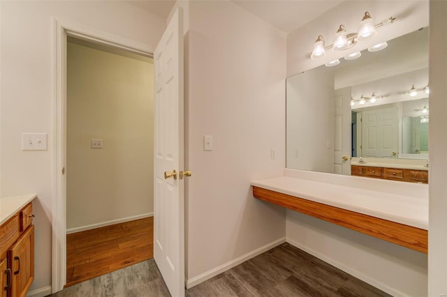 bathroom with hardwood / wood-style flooring and vanity