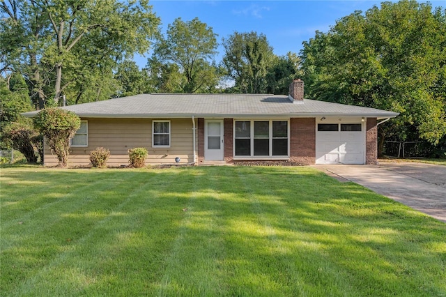 single story home featuring a garage and a front yard