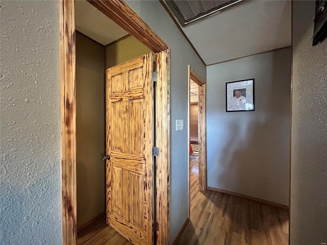 corridor featuring hardwood / wood-style flooring