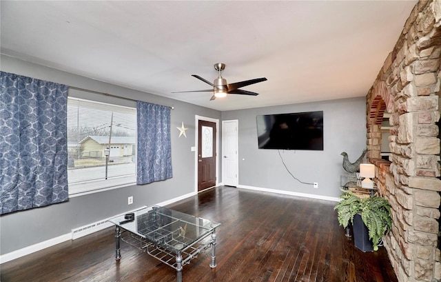 living room featuring ceiling fan, wood-type flooring, and a baseboard radiator