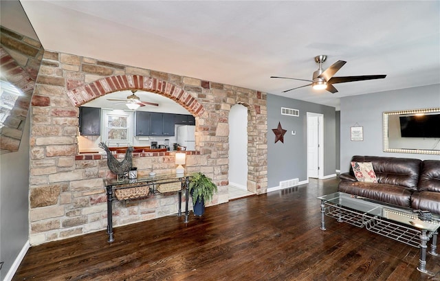 living room with dark hardwood / wood-style floors and ceiling fan