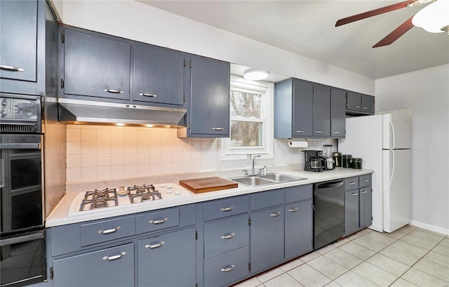 kitchen featuring blue cabinetry, ventilation hood, sink, and black appliances