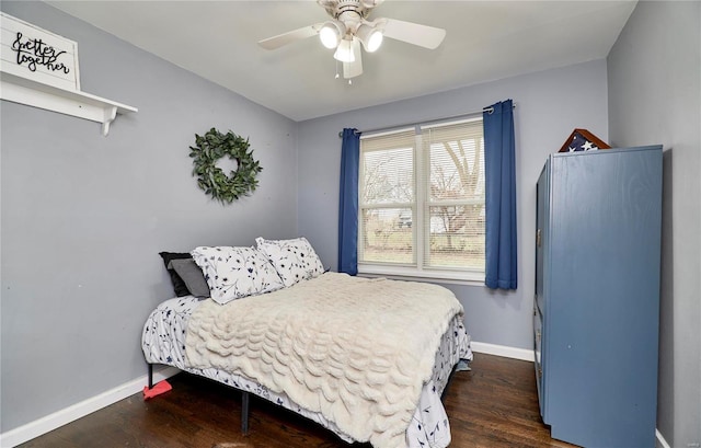 bedroom featuring dark wood-type flooring and ceiling fan