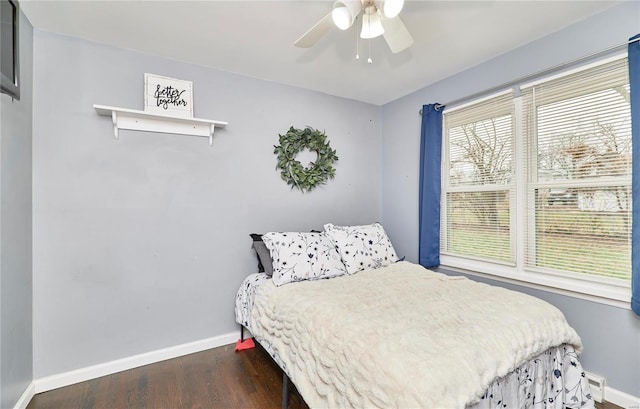 bedroom featuring dark wood-type flooring and ceiling fan