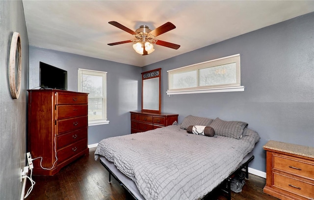 bedroom featuring ceiling fan and dark hardwood / wood-style floors