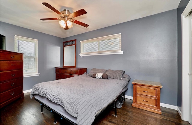 bedroom featuring dark wood-type flooring and ceiling fan