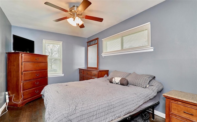 bedroom featuring dark wood-type flooring and ceiling fan