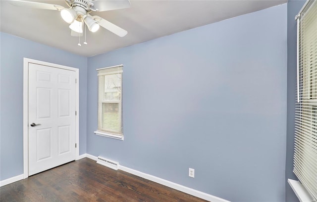 unfurnished bedroom with ceiling fan and dark hardwood / wood-style flooring