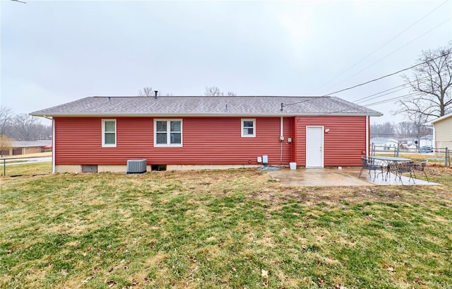 rear view of house with a patio, cooling unit, and a lawn