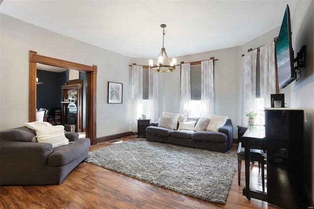 living room with a chandelier and hardwood / wood-style floors