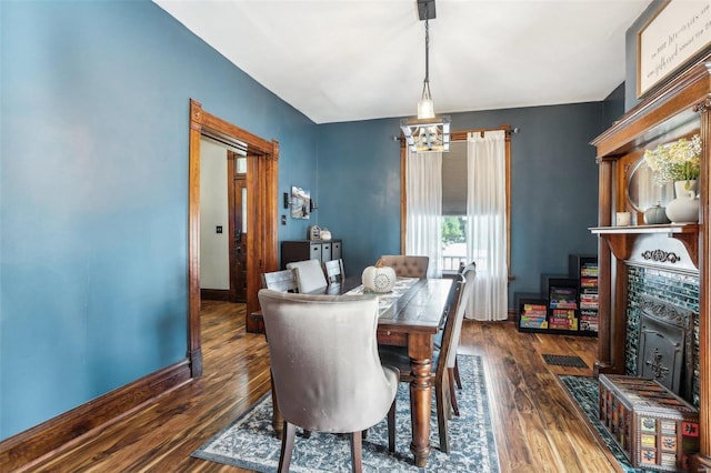 dining room featuring dark hardwood / wood-style floors and a chandelier