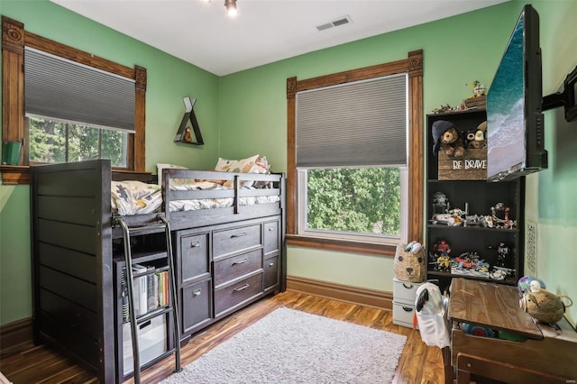 bedroom featuring wood-type flooring