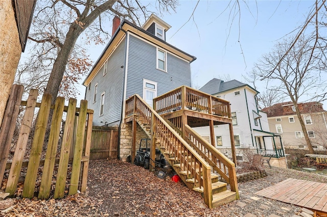 back of house with a wooden deck