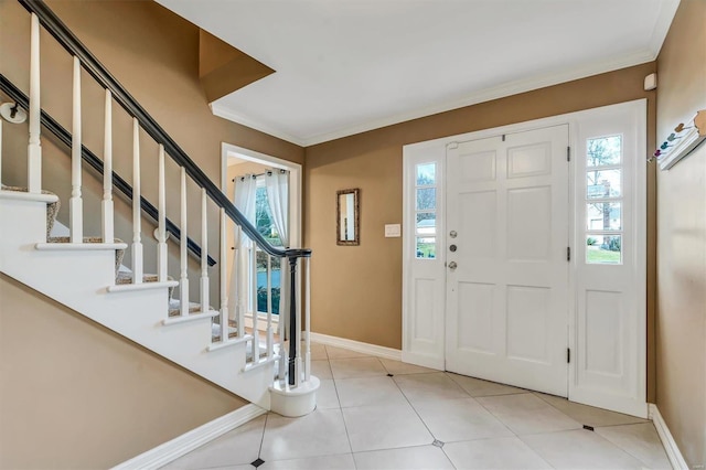 foyer entrance featuring ornamental molding and light tile patterned floors