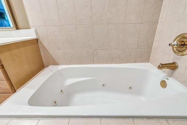 bathroom with tile walls and tiled bath