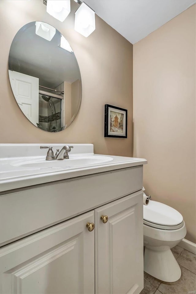 bathroom featuring vanity, tile patterned floors, toilet, and walk in shower