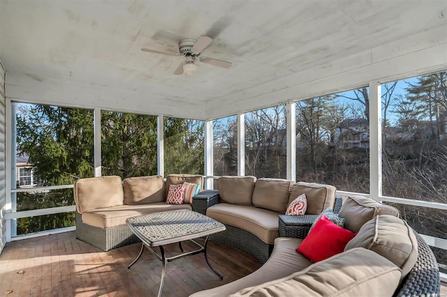 sunroom featuring ceiling fan and a wealth of natural light