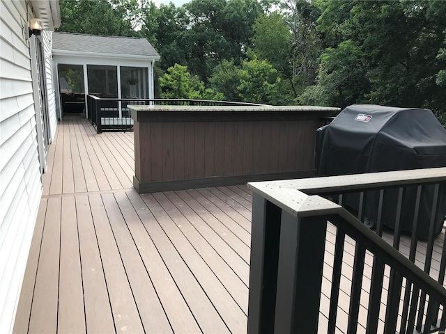 deck with a sunroom