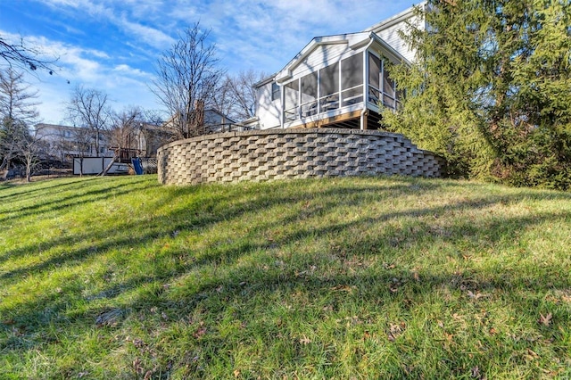 view of yard featuring a sunroom