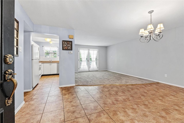 interior space with an inviting chandelier and sink