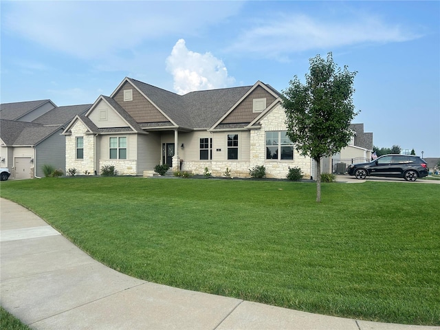 craftsman-style house with a front lawn