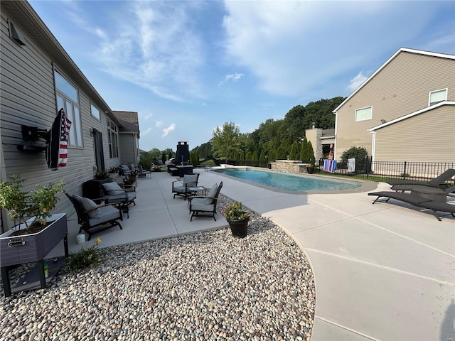 view of swimming pool with a patio